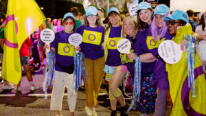 People with intersex variations at the Sydney Mardi Gras 2026, holding up signs promoting bodily autonomy
